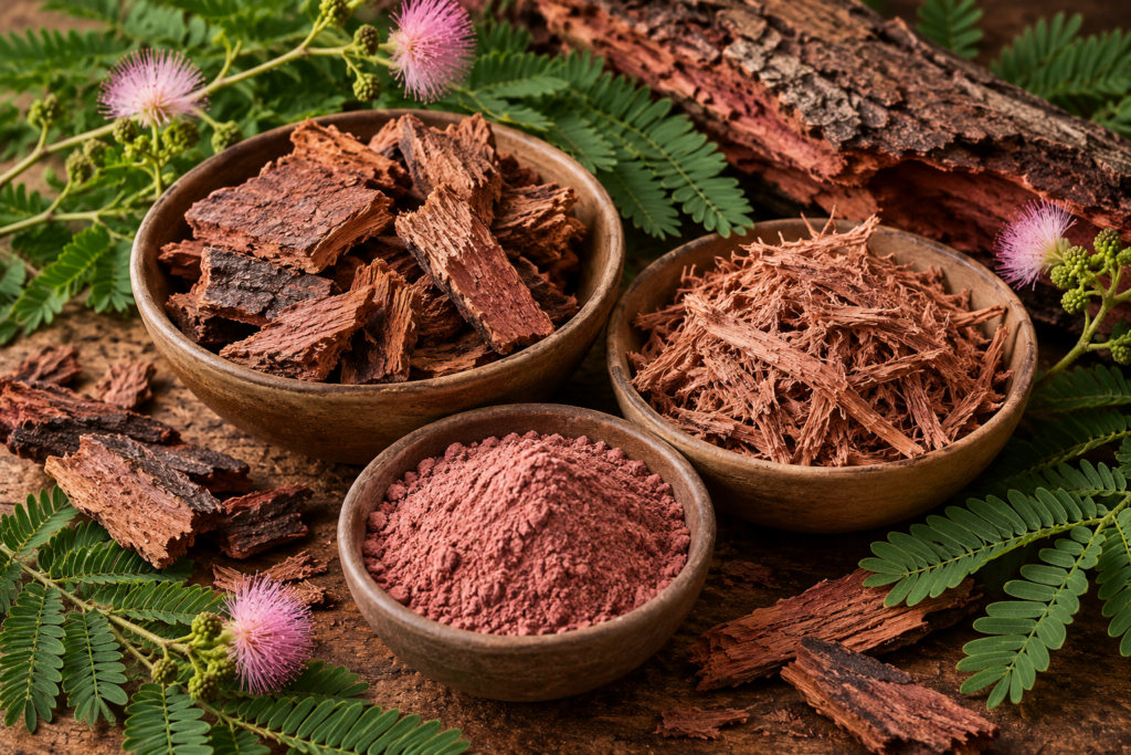 Tepezcohuite bark displayed as chunks, shredded root bark and fine powder in rustic bowls surrounded by mimosa foliage and pink flowers